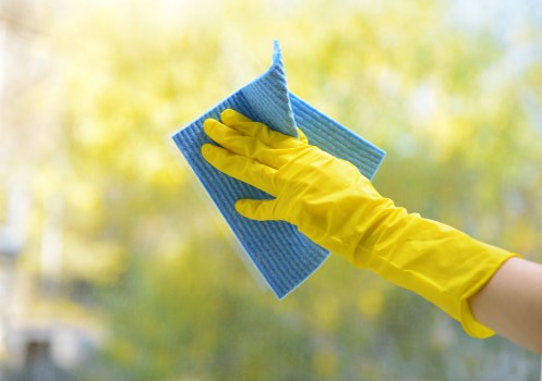 Close-up of upholstery fabric being treated with cleaning equipment