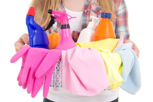 Living room sofa cleaning process with upholstery care focus