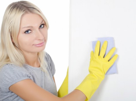 Cleaning team disinfecting a busy workplace surface